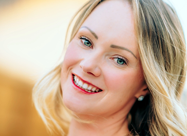 Woman smiling in side view